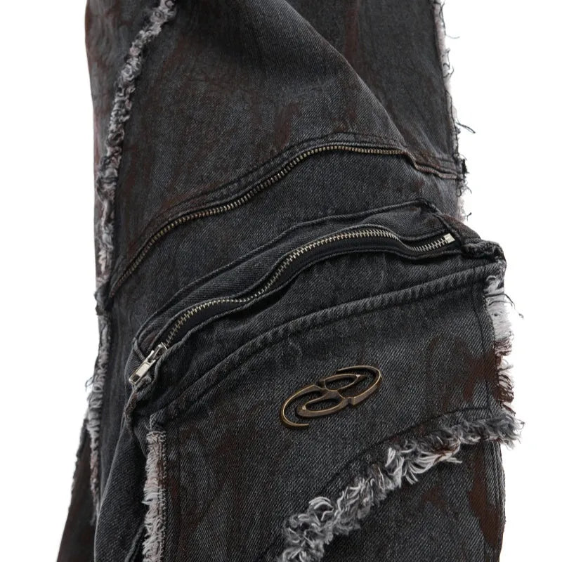 Black distressed denim coat and pants set with a gradient pattern and padded shoulders.