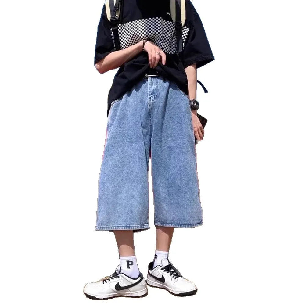 Blue washed denim pirate shorts for men with a high waist and straight leg, laid flat.