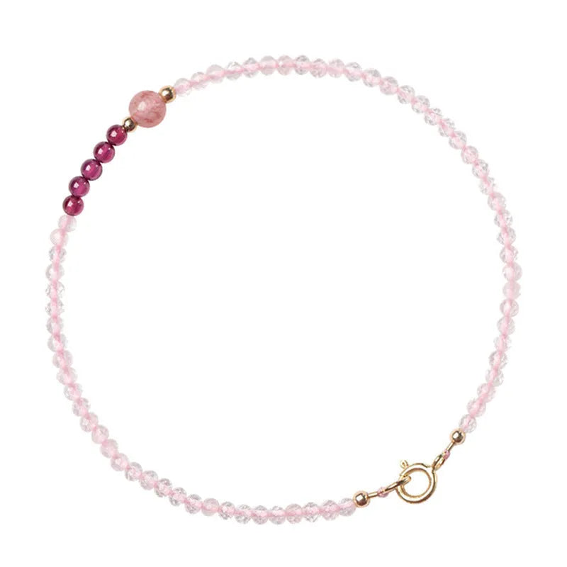 Handmade pink crystal bracelet with strawberry quartz beads and a zodiac animal charm