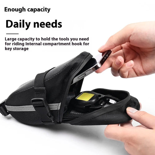 Black polyester bicycle saddle bag with quick release mount under a bike seat