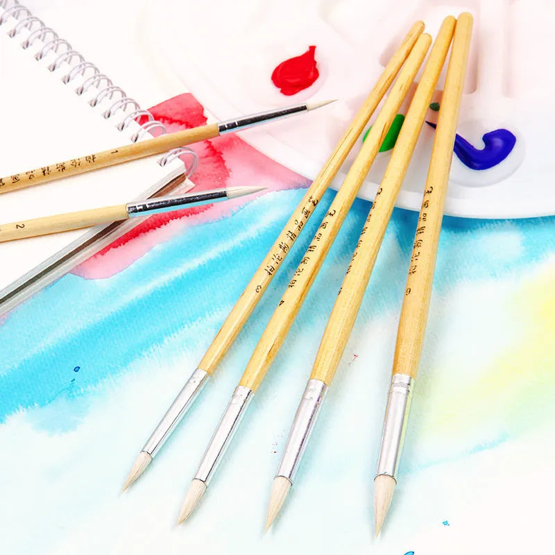 Six wooden hook line pen brushes with wool pointed tips arranged together