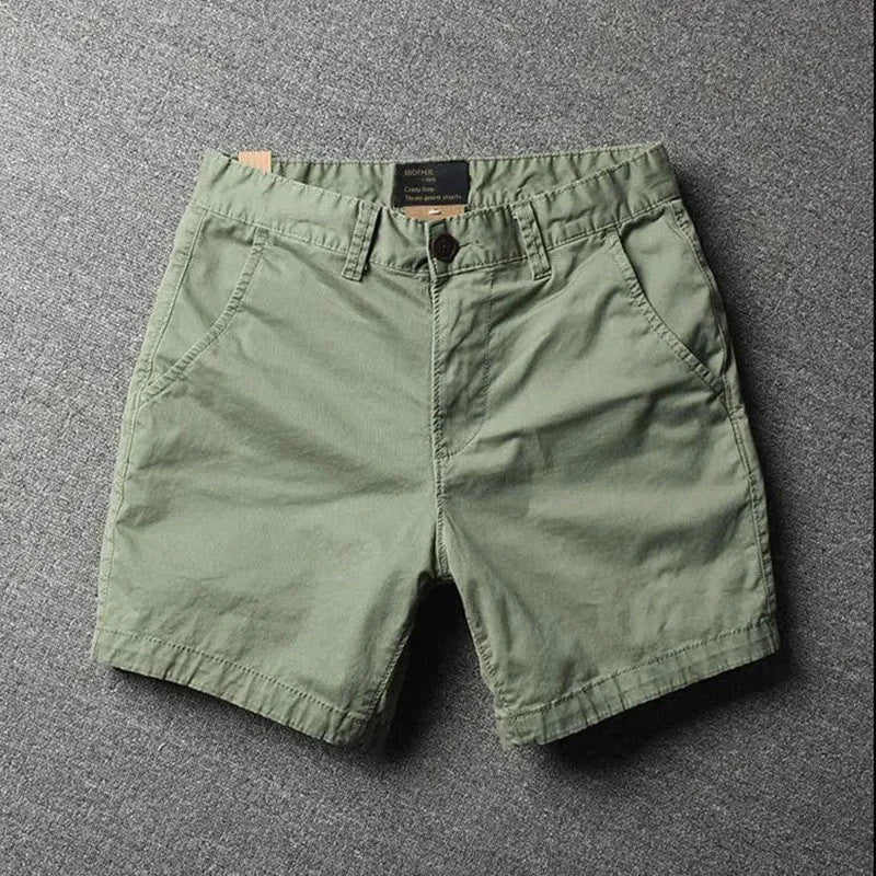 Men's cotton loose shorts in straight-leg cut with zipper fly, shown in multiple colour options including camouflage patterns