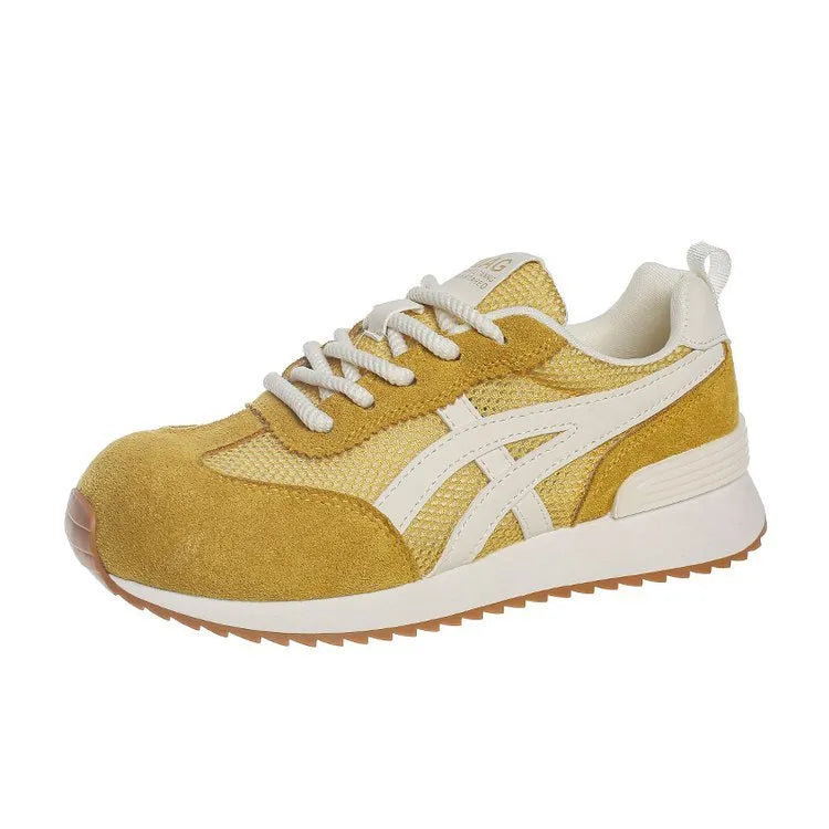Women's white casual lace-up sneakers with round toe and non-slip sole on a plain background.