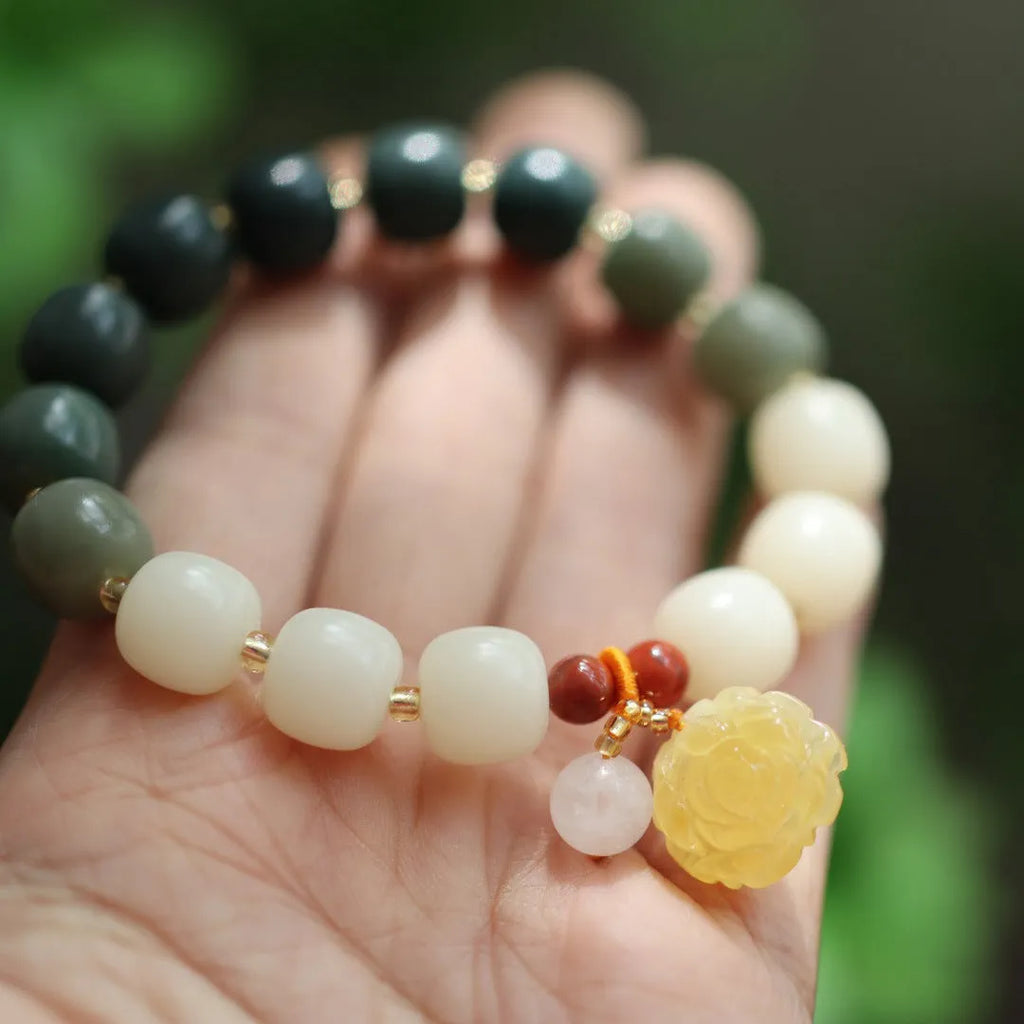 Gradient white jade Bodhi root bracelet with natural beeswax lotus charms, 10mm flower shape
