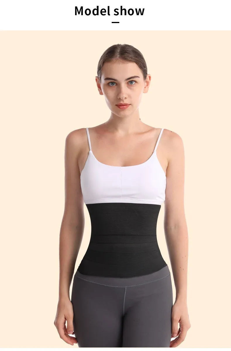 A long roll of a black latex silk waist trainer restraint belt, showing its 10cm width, laid flat.