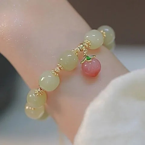 Coloured glass bracelet with rabbit motif in national style design for unisex wear