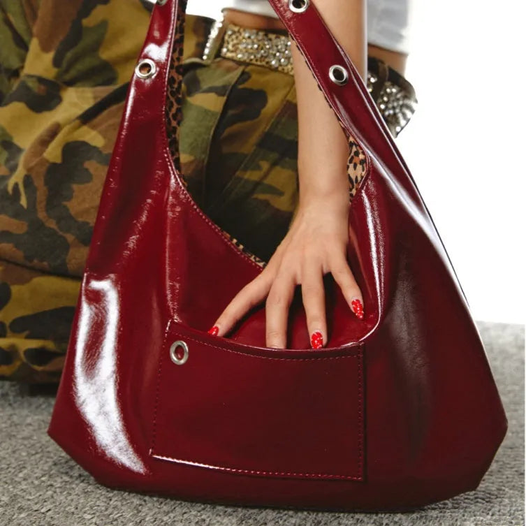 Red leopard print women's shoulder bag with two-sided carry straps and dumpling shape