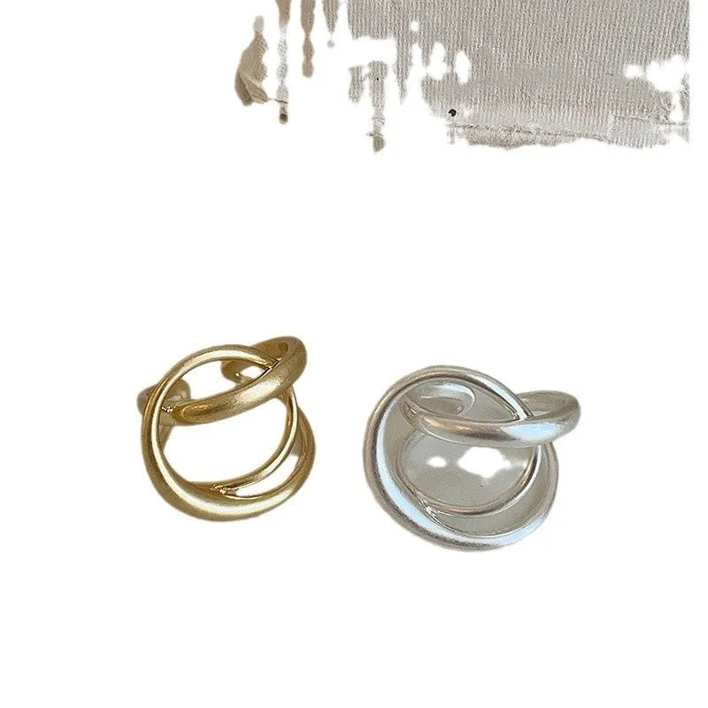 Women's geometric open ring with interlaced design in matte gold or silver tone metal