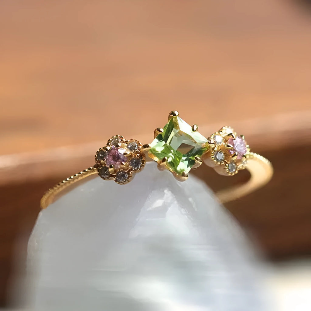Women's copper ring with geometric flower design in Q740 gold colour, shown on a hand, available in sizes No 6 to No 10