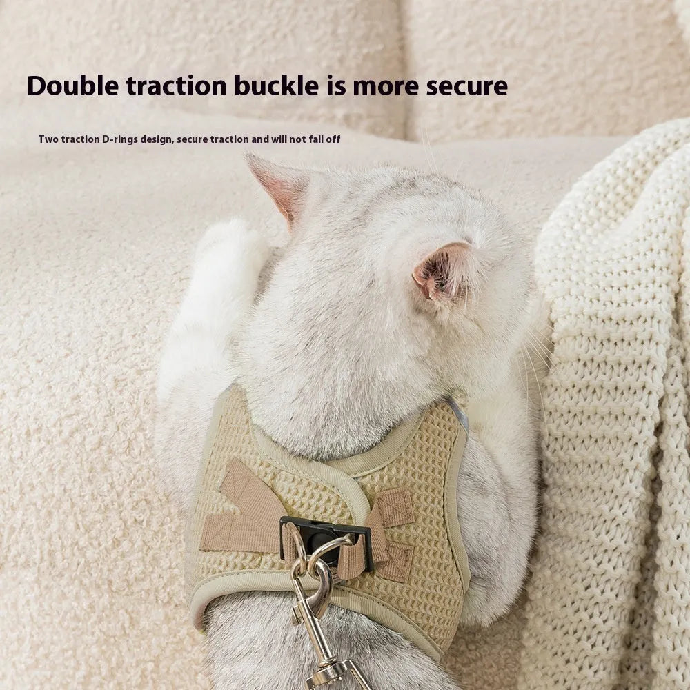 Brown waffle-textured cat harness with chest strap and lead on wooden floor