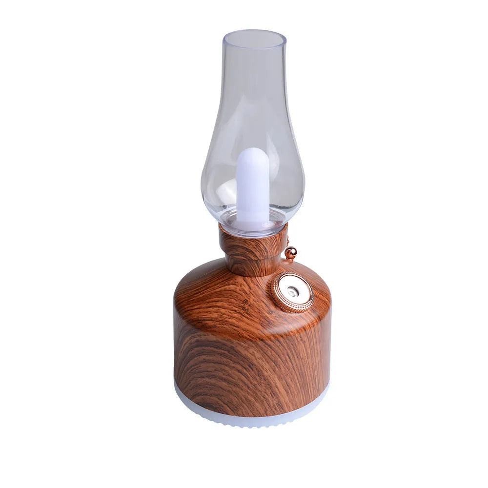 Kerosene lamp ultrasonic humidifier in brass colour with single fog outlet on wooden desk