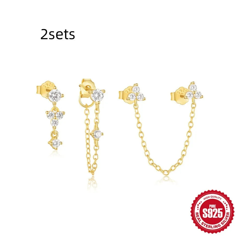 Set of three S925 sterling silver geometric stud earrings with zircon accents in gold tone.