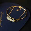 Women's jade lucky beads bracelet with gold inlay treatment in single, double, and three bead styles.