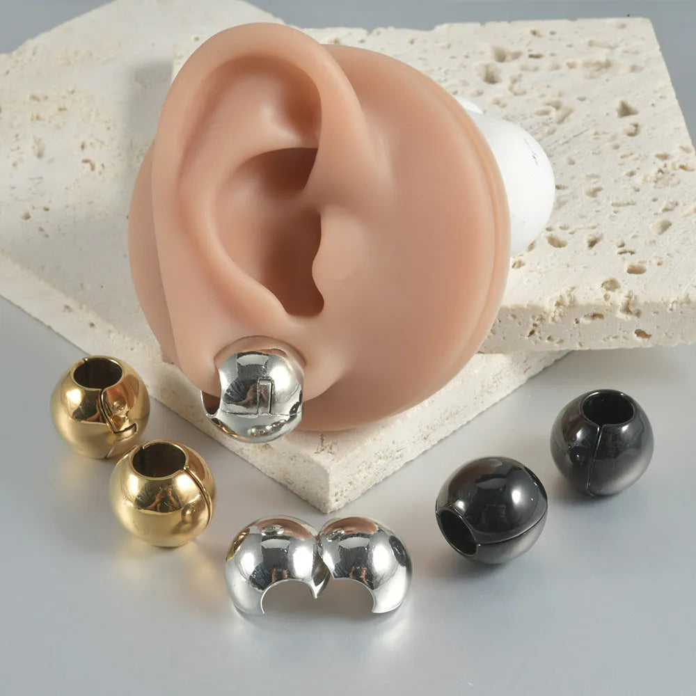 Stainless steel hollow skull Buddha earring in a geometry shape, shown in one of four colour options.