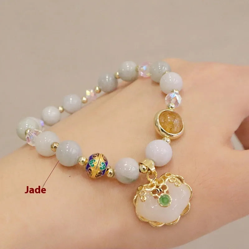 Women's geometric bracelet in choice of gray jade or strawberry quartz with ethnic metal decorations