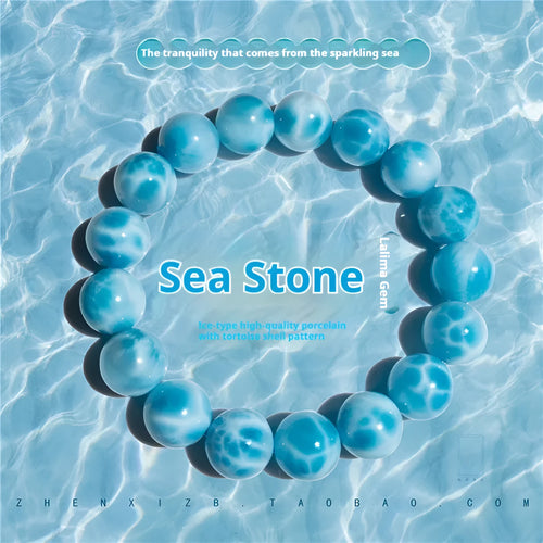 Blue Bodhi bracelet with natural sea-pattern crystal stones and pearl details in Maillard style.