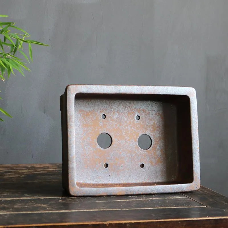 Large and small rectangular purple sand bonsai pot with firewood-burning texture for pine trees.