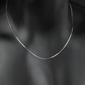 S925 sterling silver plated platinum snake bone chain necklace on display, silver colour, unisex design, 45-60cm length options