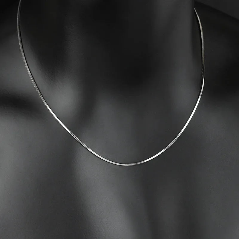 S925 sterling silver plated platinum snake bone chain necklace on display, silver colour, unisex design, 45-60cm length options