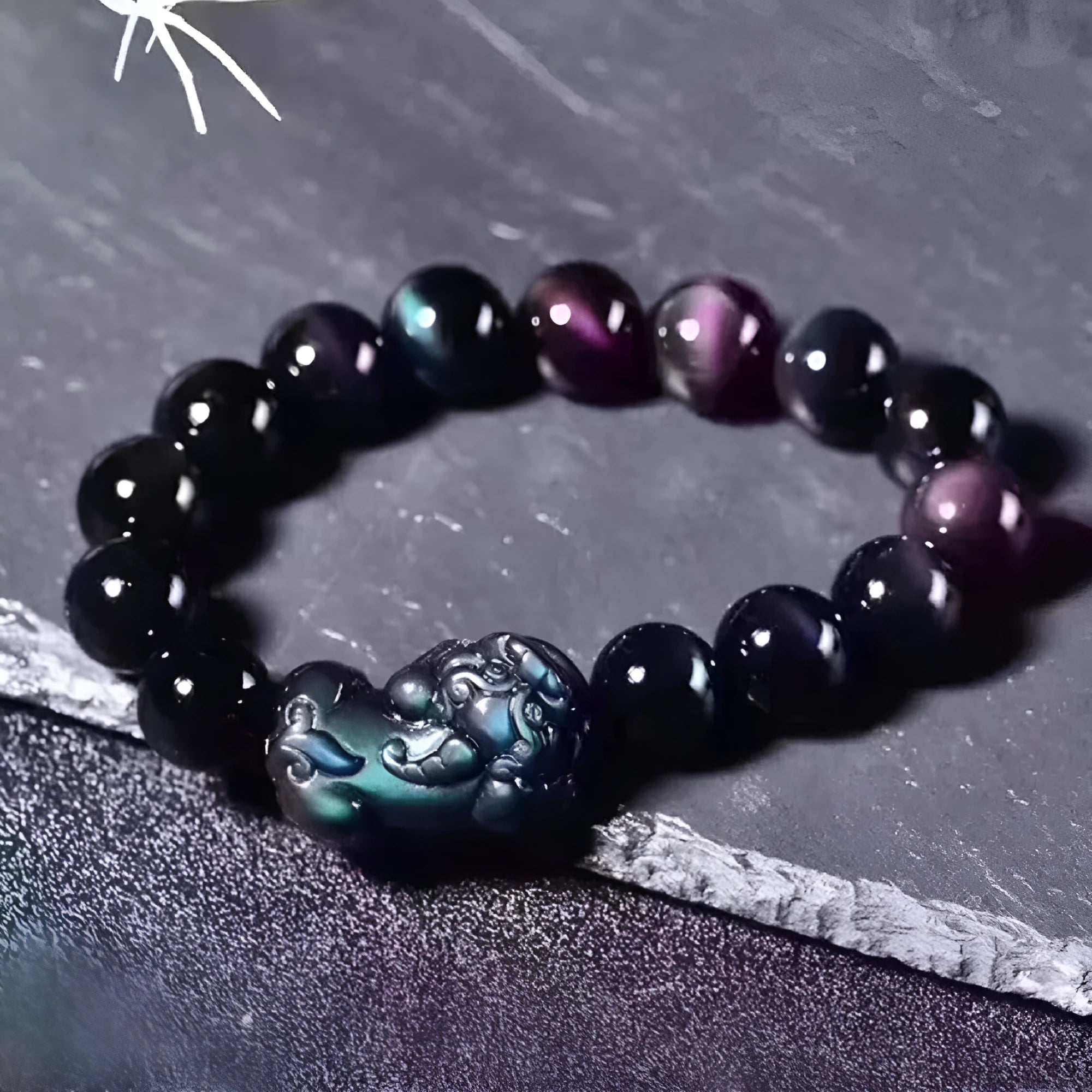 Natural ice colour eye obsidian crystal bracelet with varying bead sizes on wrist