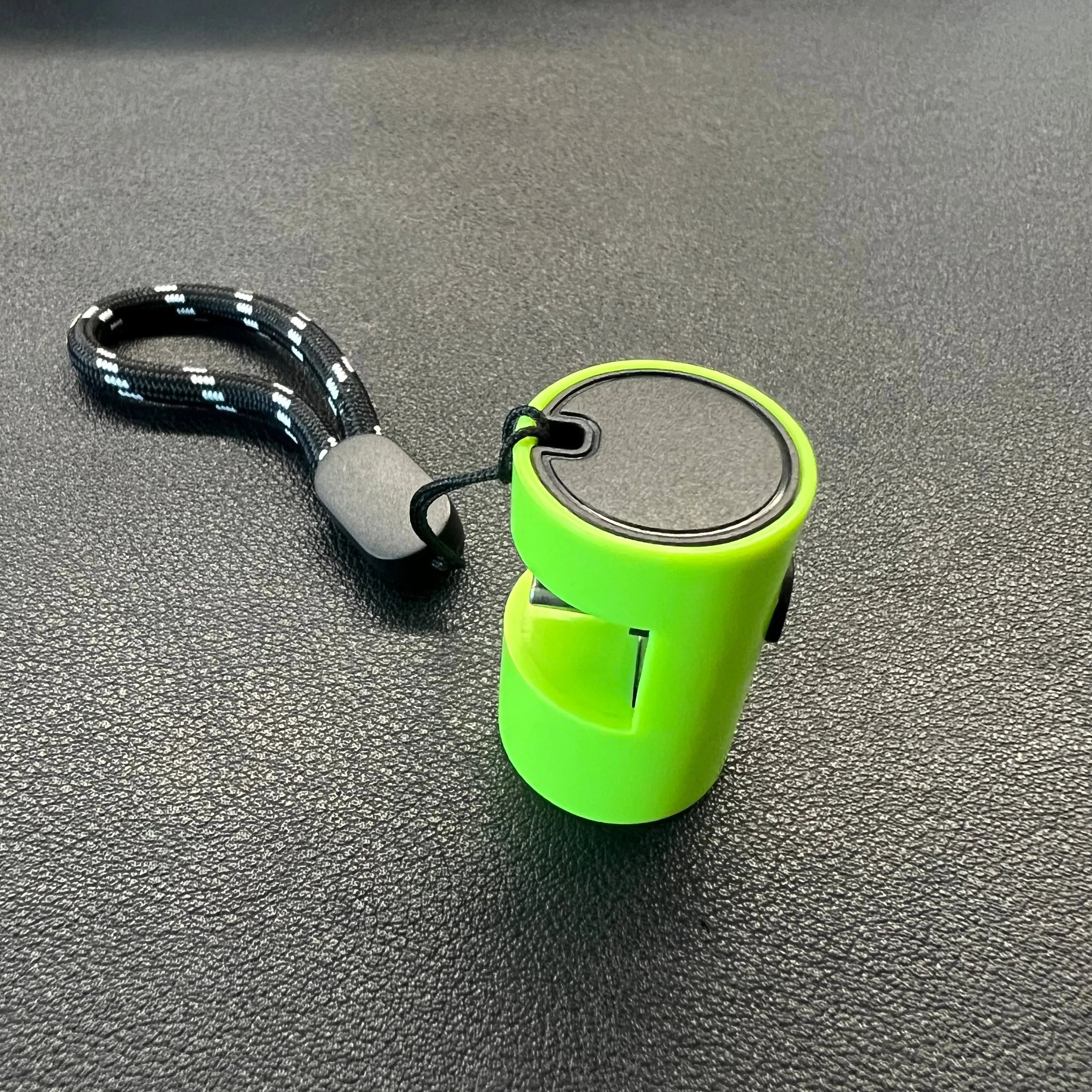 Green mobile phone mini torch with Type-C interface and LED light wick on a keychain