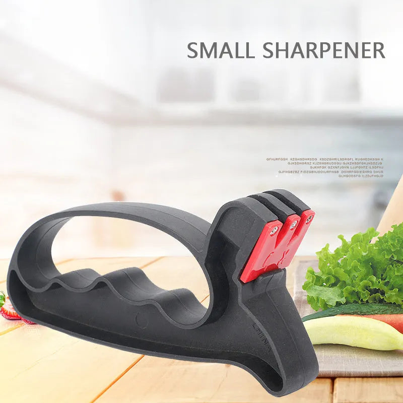 Black handheld knife and scissor sharpener tool with ergonomic handle and tungsten steel blade