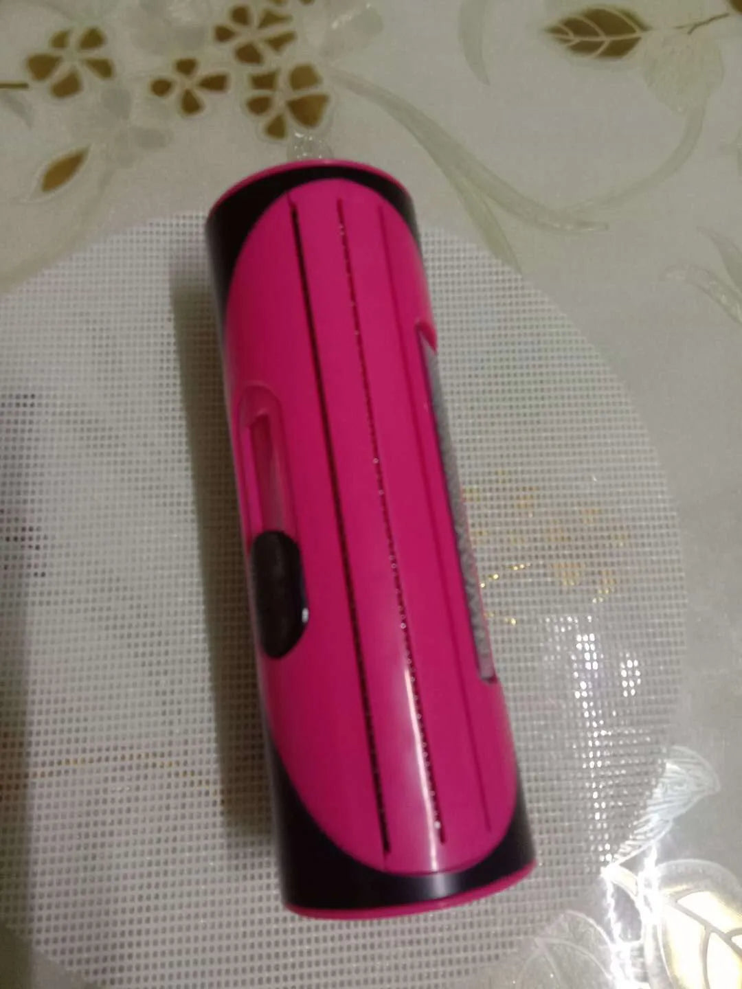 Pet comb with stainless steel teeth and red ABS handle for grooming dogs and cats.