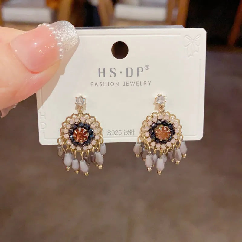 Geometric crystal tassel earrings with thick gold plating and embedded diamond crystals