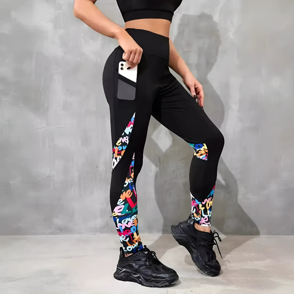 Women's black high waist yoga leggings with contrast patchwork leopard print design and side pocket