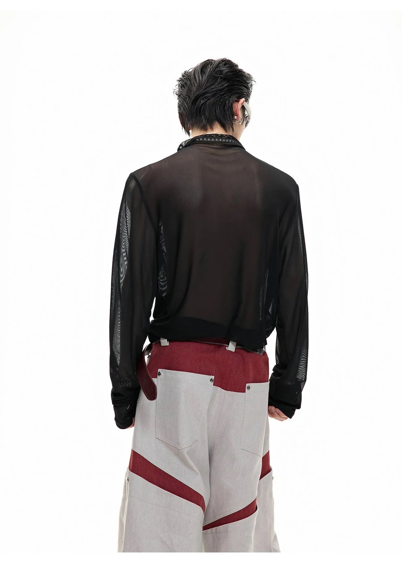 Slim-fit long-sleeved mesh shirt in black, shown as a base layer for athletic wear.