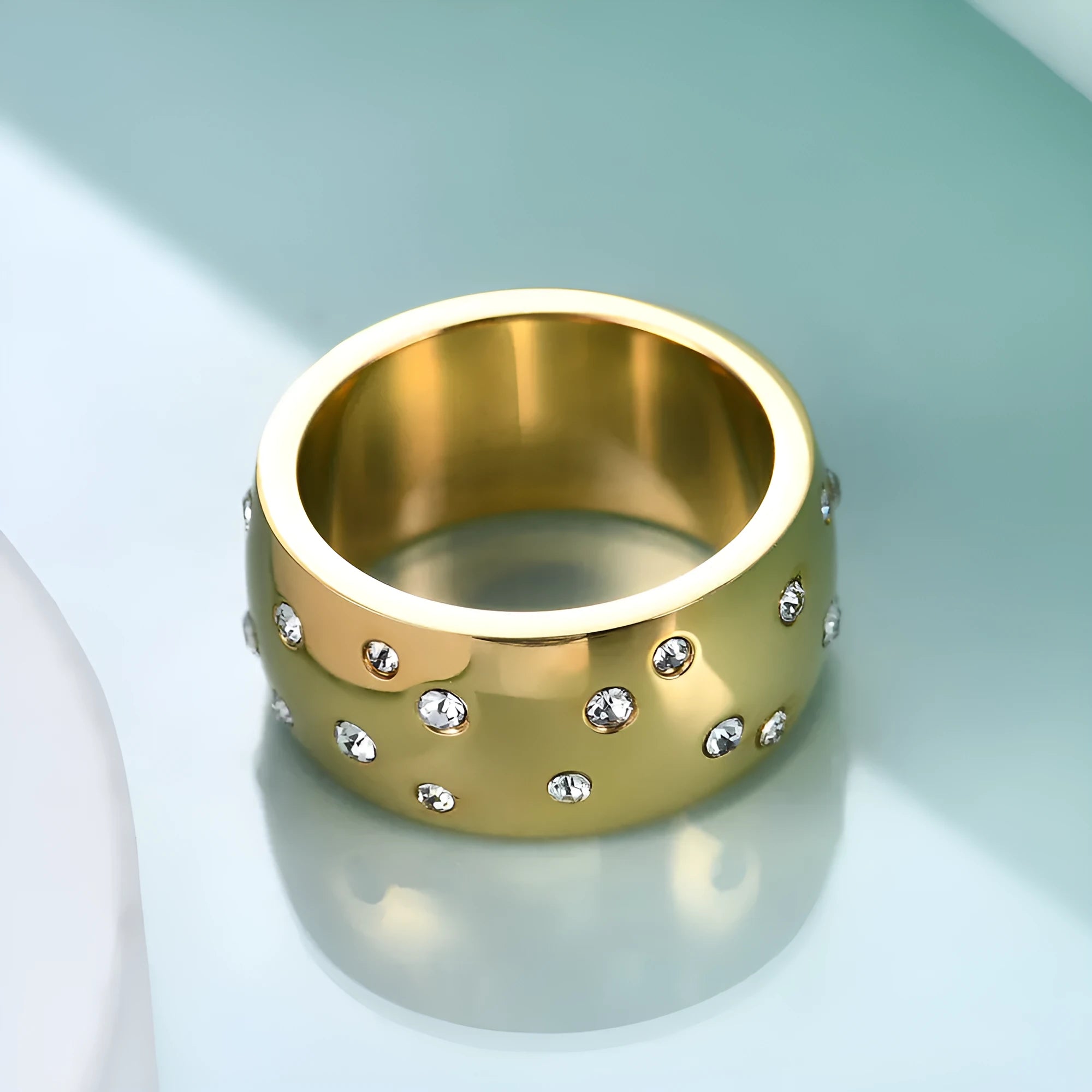 Geometric titanium steel women's ring with a round diamond accent in black, gold, rose gold, or steel colour.