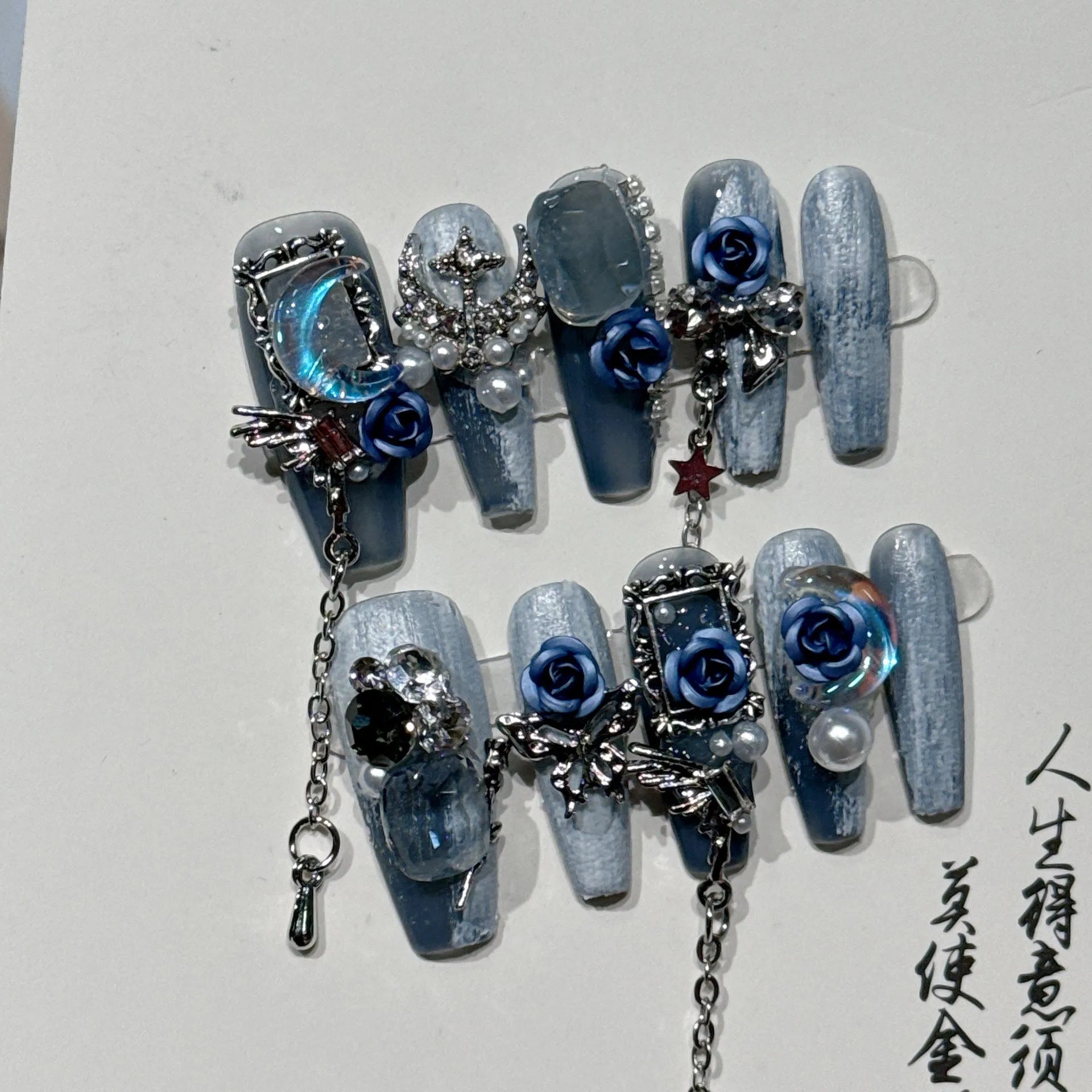 Blue false nails with rose flower pattern for evening manicure in four sizes