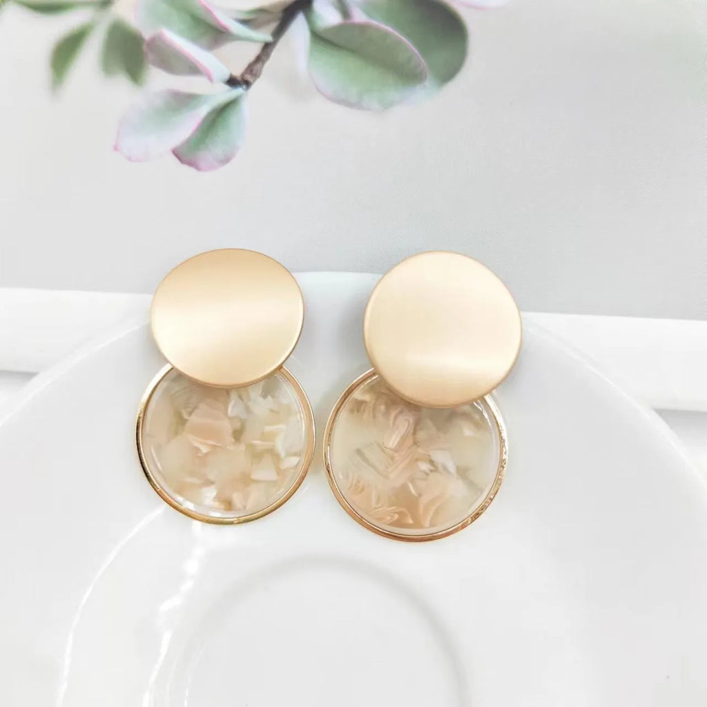 Round matte resin female earrings with retro design and smooth surface for casual wear.