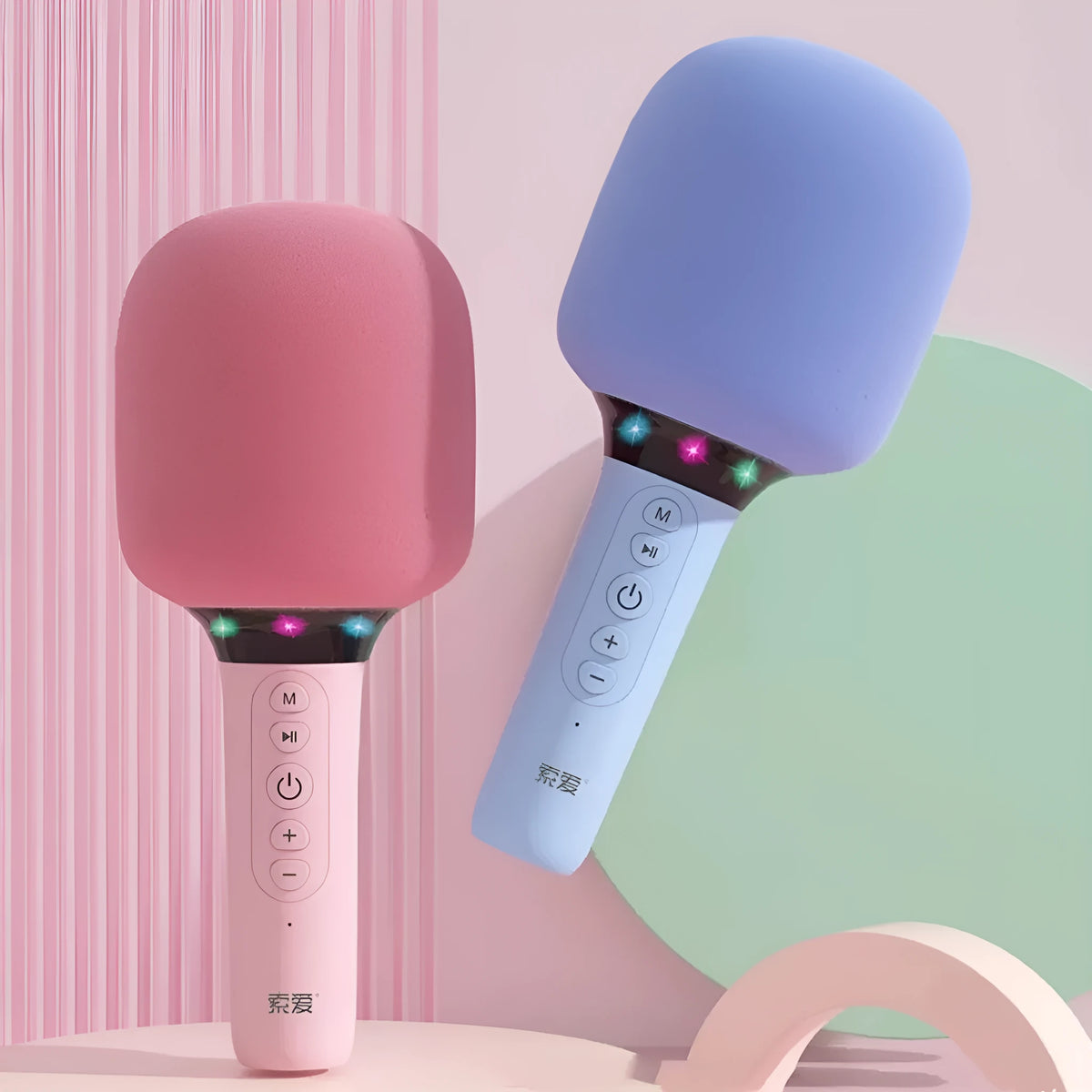 Pink Bluetooth children's handheld karaoke microphone with built-in speaker on white background