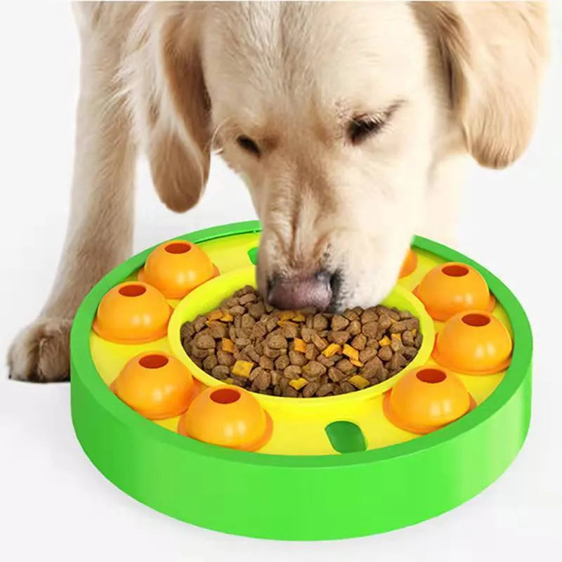 Square blue interactive dog puzzle bowl with a central feeding column and a turntable lid on a wooden floor.
