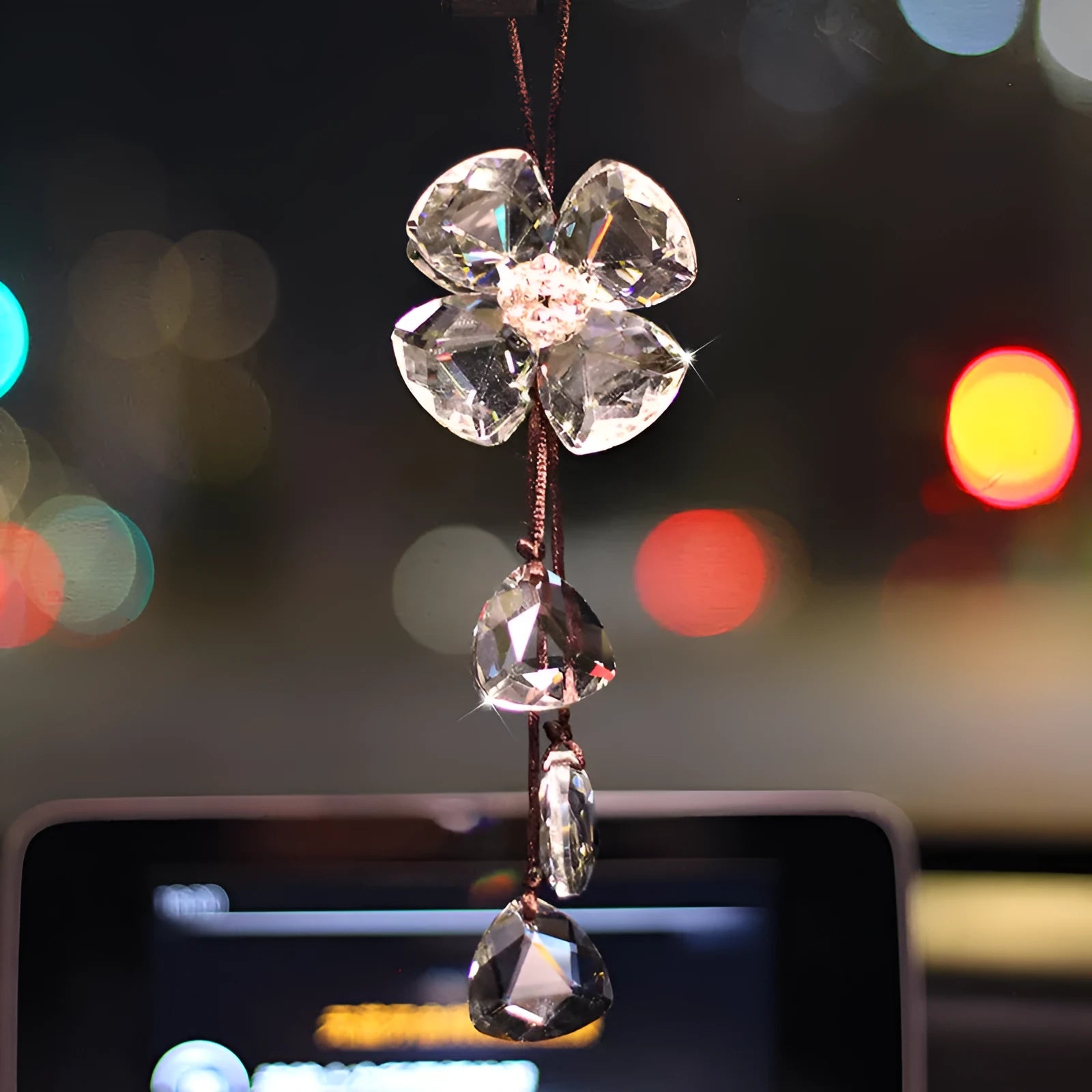 Crystal Four Leaf Grass car pendant hanging, showing its approximately 20cm size and transparent finish.