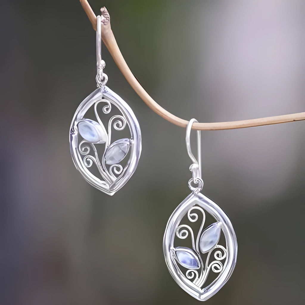 Silver leaf-shaped earrings with colourful embedded moonstone pieces and diamond treatment