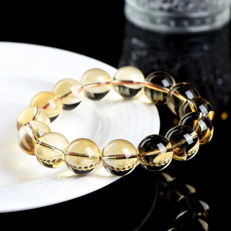 Natural citrine scattered beads bracelet showing polished yellow gemstones on a string, available in multiple bead sizes.