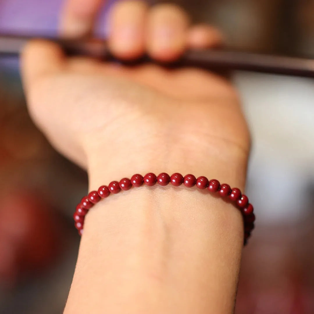 Natural cinnabar bracelet with purple gold sand design and geometric shape featuring auspicious patterns