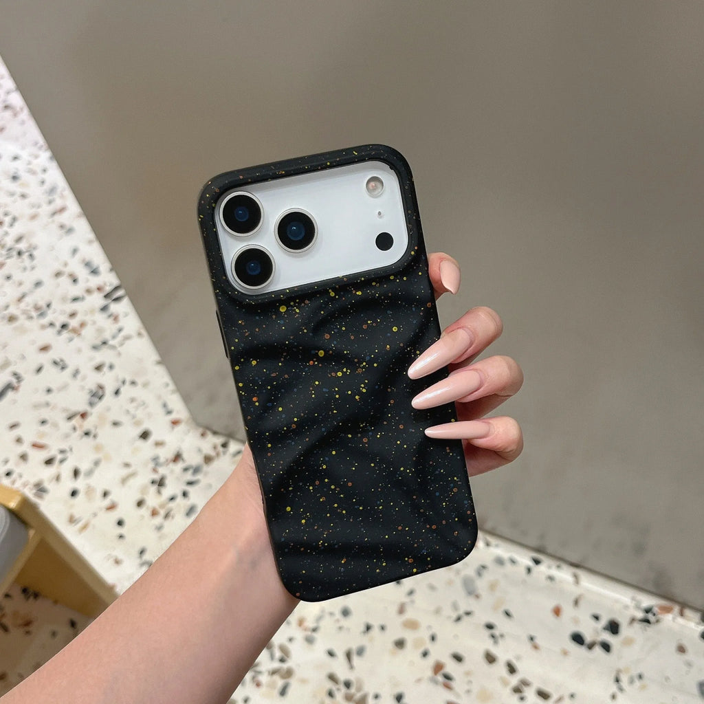 TPU phone case with splash ink pattern in black fitted on an iPhone showing the camera cutout