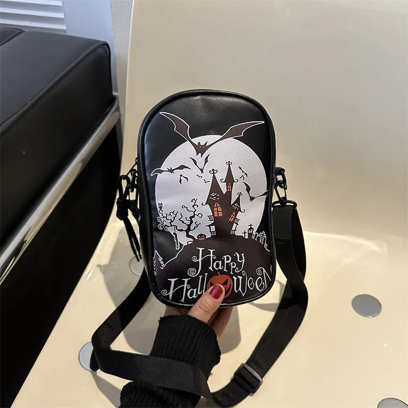 Halloween graffiti print crossbody phone bag with cartoon pumpkins, in multiple colours.