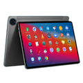 10-inch bare metal blue tablet PC on a desk with charger, USB cable, and screen protector.