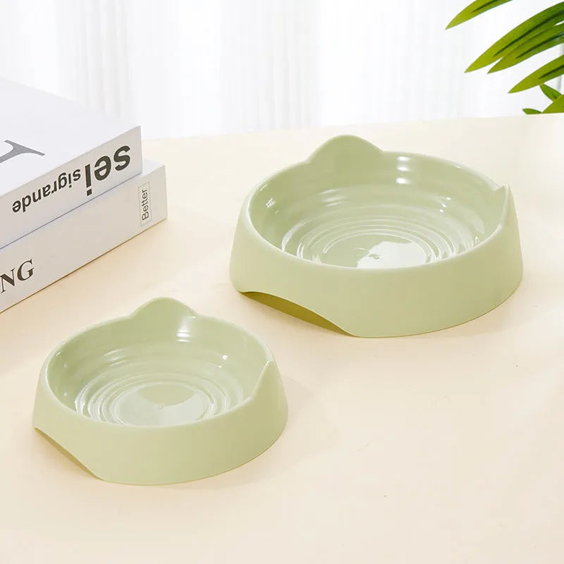 Ceramic dog slow feeder bowl with puzzle maze design in blue, green and pink colours showing S and L size options
