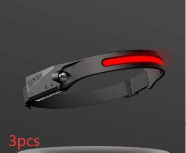 Black silicone USB rechargeable LED headlamp with side wave sensor, showing wide beam and long-range lighting.