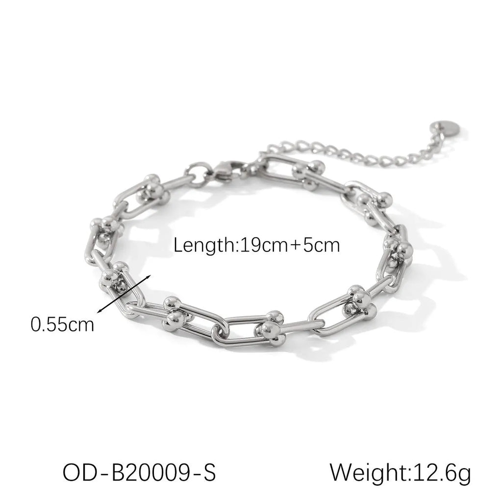 Stainless steel horseshoe charm jewellery set showing necklace, bracelet, and earrings with titanium steel pendants on a regular chain.