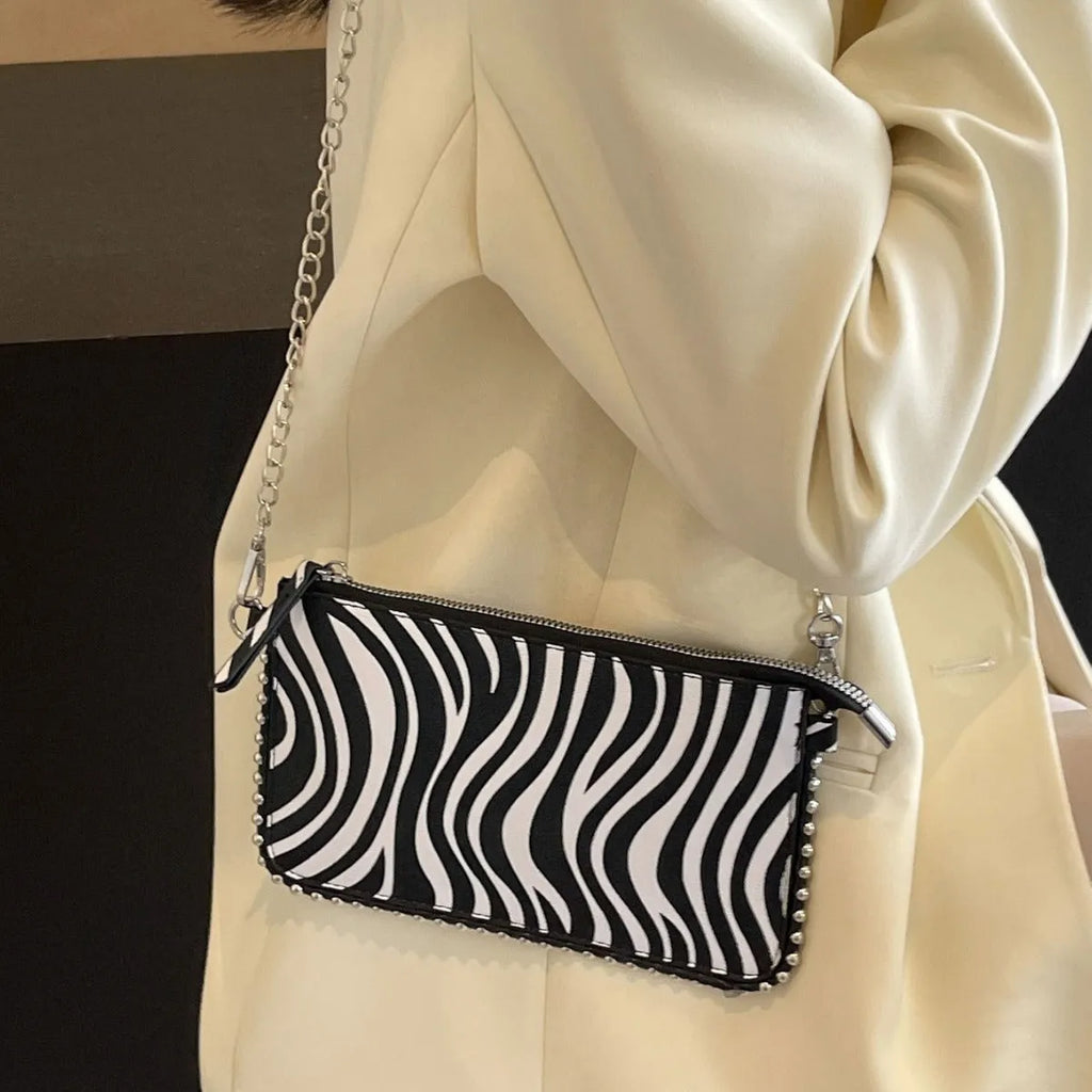 Women's square crossbody bag in PU leather with chain detail, shown in dark brown colour