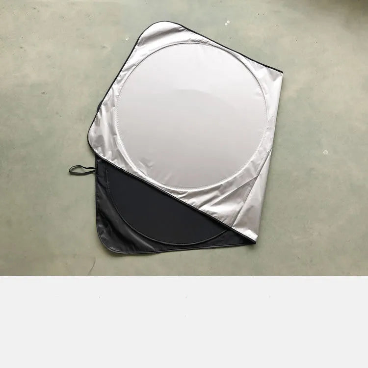 Silver tape car sunshade in 190x90cm size laid against a car windshield