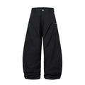 Black men's pleated casual trousers with a loose wide-leg fit on a hanger