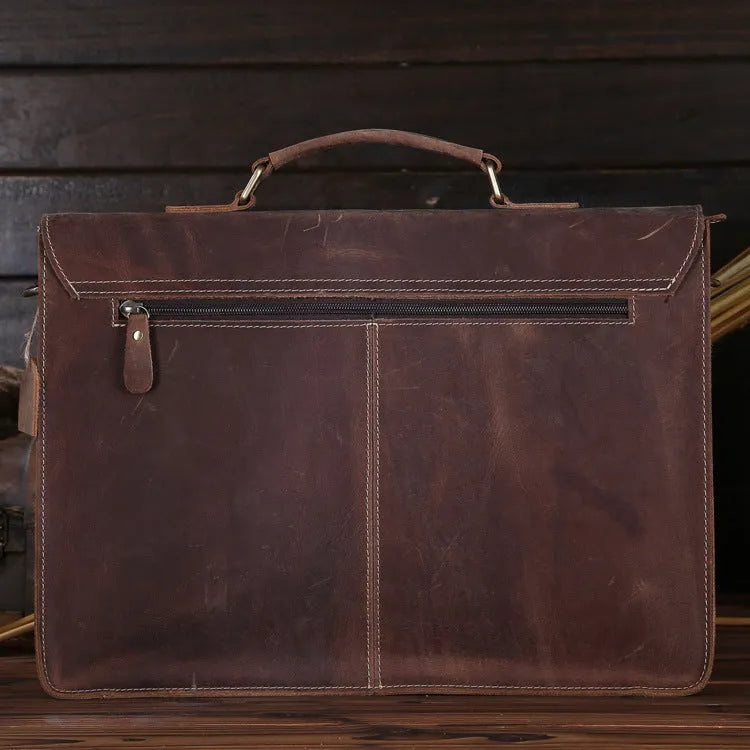 Small yellow brown Crazy Horse leather messenger bag with shoulder strap and nylon lining.
