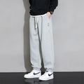 Men's loose fit sports trousers in grey colour with elastic waistband and drawstring closure